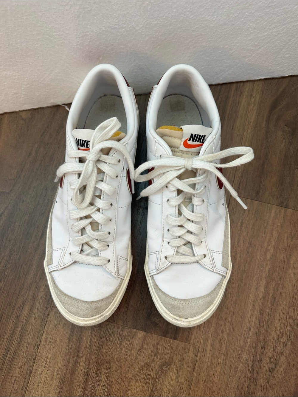 Nike Blazer White Low-Top Sneakers with Deep Red Swoosh and Orange Tongue Detail